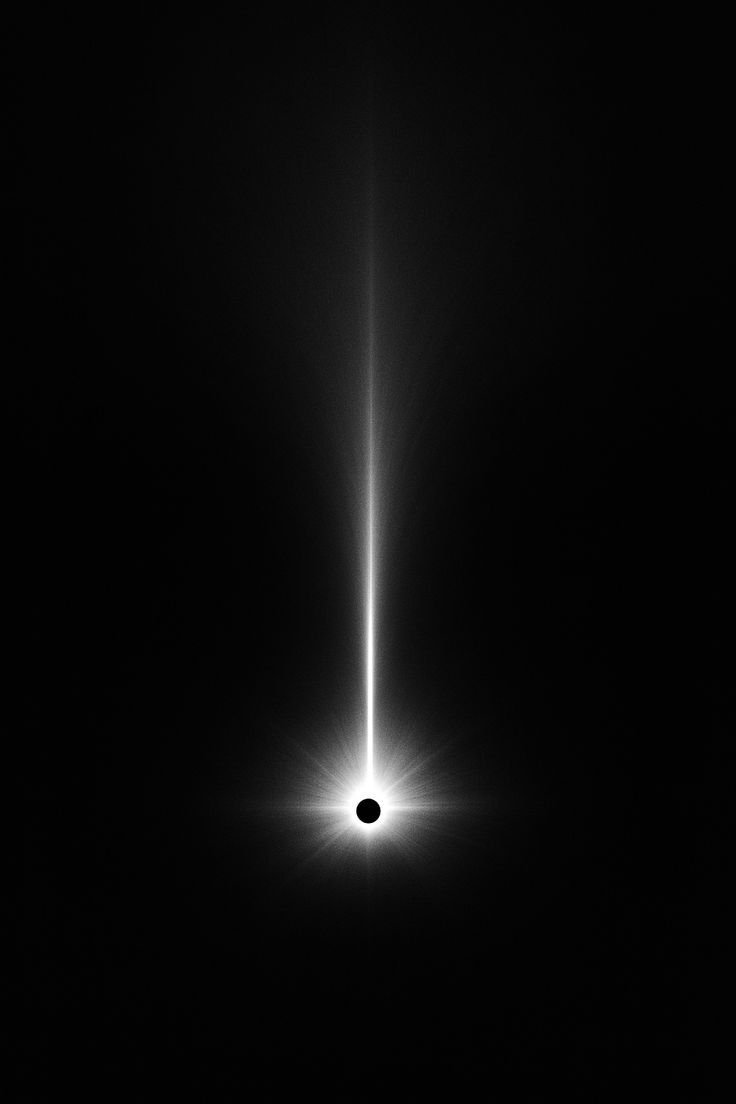 A single beam of light falling onto a dark point
